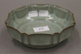 A Chinese celadon bowl. 16 cm diameter.