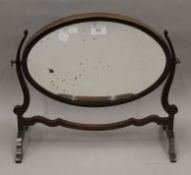 An Edwardian mahogany dressing table mirror. 48 cm wide.