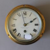 A brass ships clock. 17.5 cm diameter.