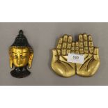 A bronze hand and Buddha head. The former 11 cm wide.