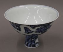 A Chinese blue and white porcelain stem cup. 16 cm diameter.