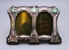 A silver double Art Nouveau style photograph frame. 11 cm wide.