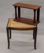 A small mahogany hanging shelf and a cane seated oak stool. The latter 50 cm wide.