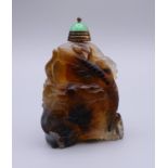 A Chinese carved agate snuff bottle. 5.5 cm high.