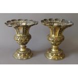 A pair of 19th century gilt copper chalices. 21 cm high.