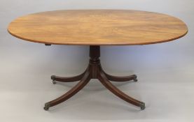 A 19th century mahogany breakfast tilt top table. 155 cm long.