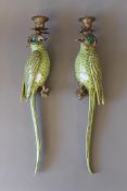 A pair of gilt metal mounted porcelain wall sconces formed as parrots. 47 cm high.