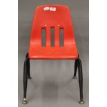 A 1950s Virco, Los Angeles, red child's chair. 34 cm wide.