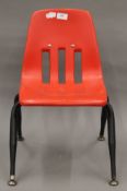 A 1950s Virco, Los Angeles, red child's chair. 34 cm wide.