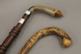 A horn handled walking stick and another. The former 91 cm long.