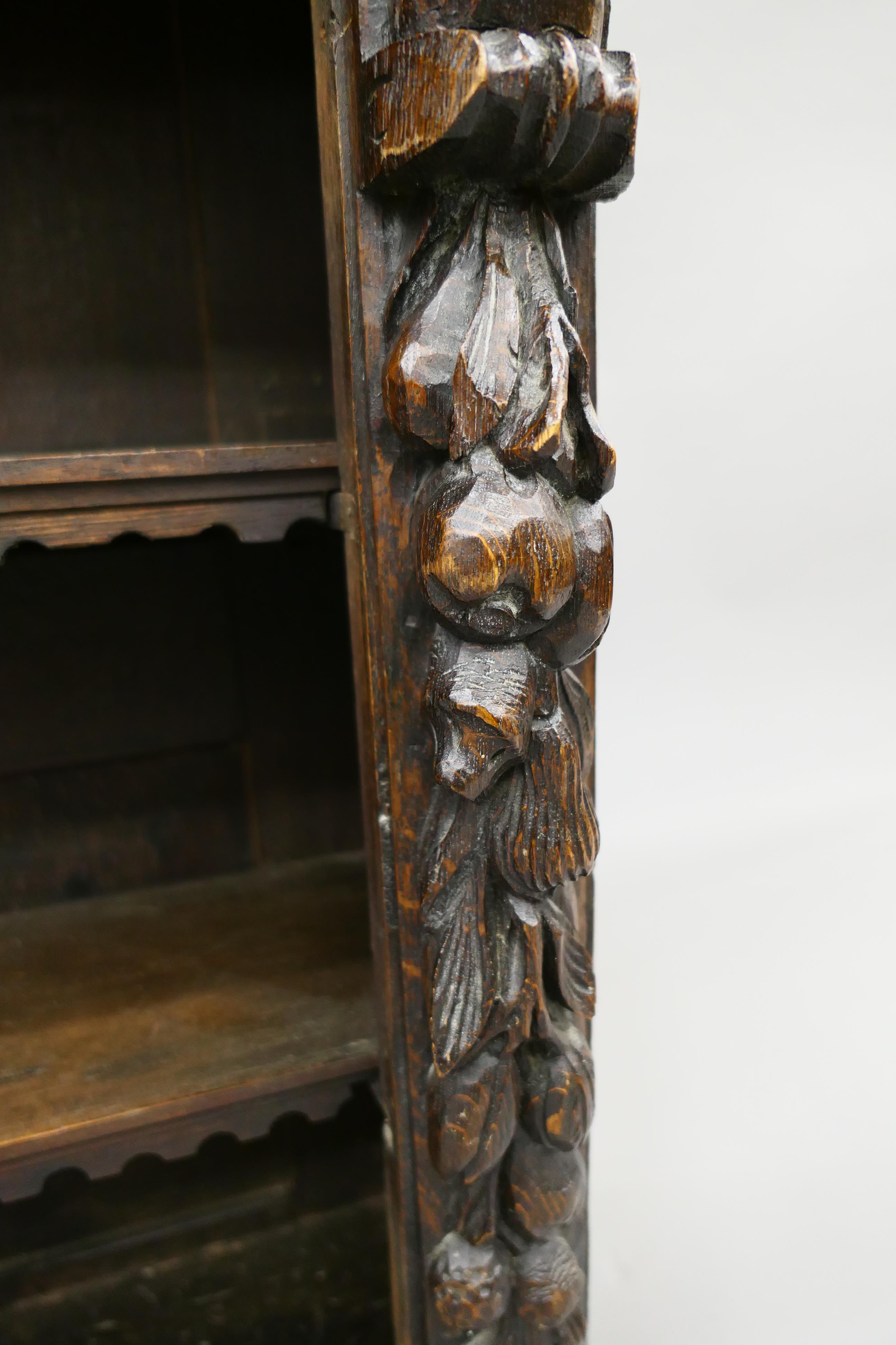 A 19th century oak bookcase carved with figures and foliage. 69.5 cm wide. - Image 5 of 13