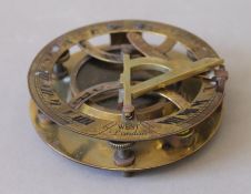 A brass sundial compass. 11 cm diameter.