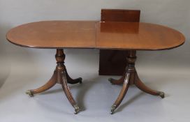 A modern twin pillar dining table. 225.5 cm long extended.