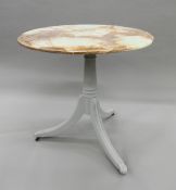 An onyx topped tripod table. 75 cm diameter.