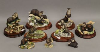 A quantity of Border Fine Arts models of otters.