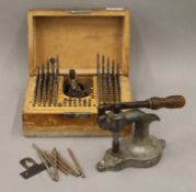 A watch clockmakers staking set, etc. The box 22 cm wide.