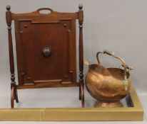 A brass fender, a copper coal scuttle and a fire guard. The fender 139 cm wide.