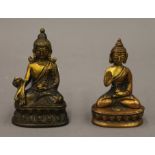 Two small models of Buddha. The largest 9 cm high.