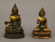 Two small models of Buddha. The largest 9 cm high.