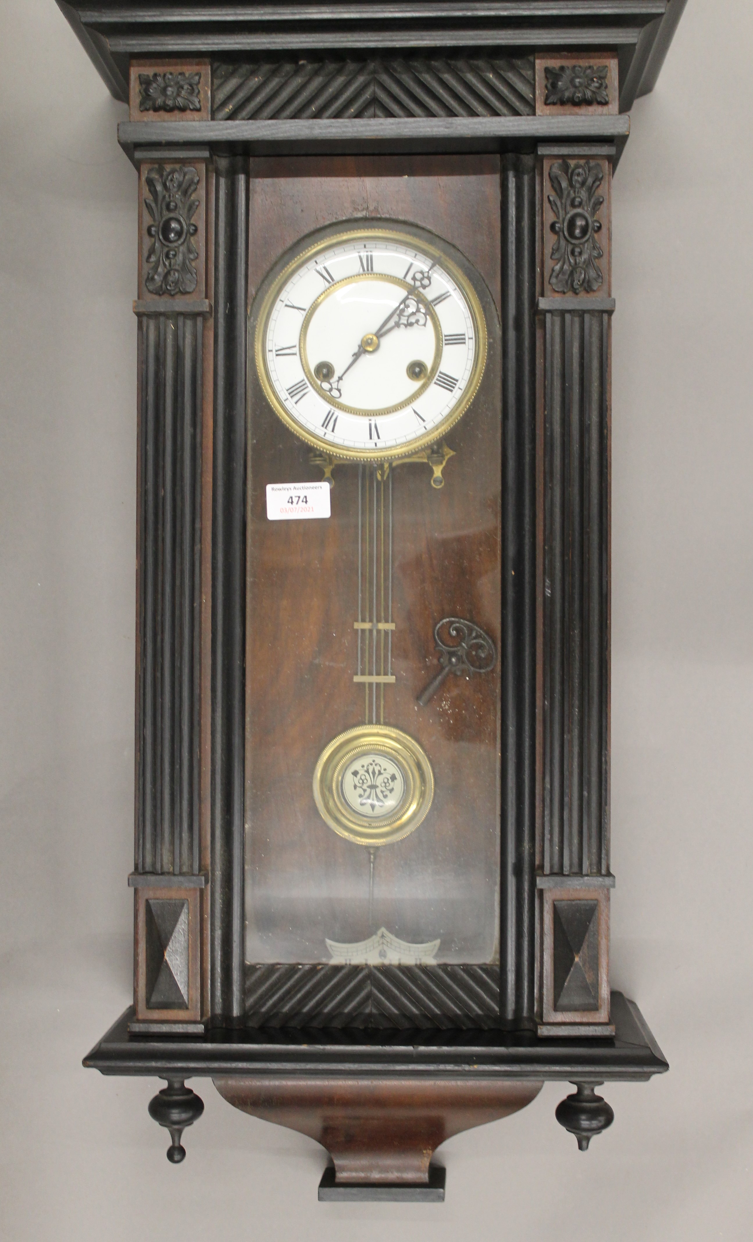 A 19th century Vienna wall clock. 74 cm high.