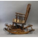 A late 19th/early 20th century oak child's rocking chair. 35.5 cm wide.