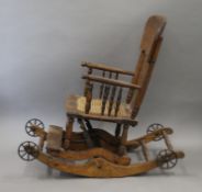 A late 19th/early 20th century oak child's rocking chair. 35.5 cm wide.