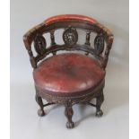A 19th century leather upholstered carved oak Burgomeister chair. 71 cm wide.