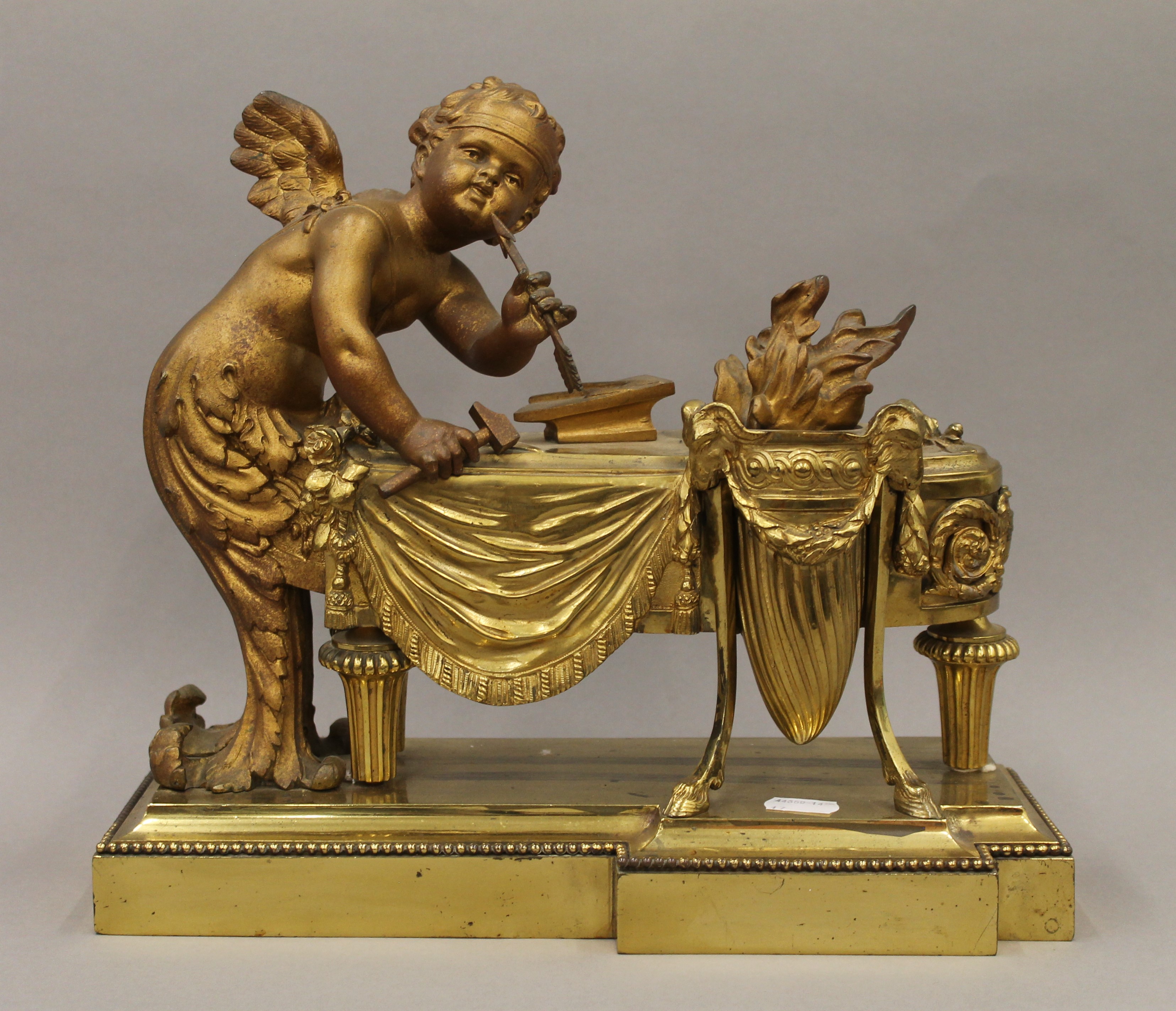 A bronze model of a cherub. 33.5 cm wide.