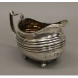 A Georgian silver cream jug. 14 cm long.