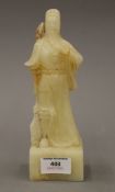 A Chinese carved soapstone deity. 21 cm high.