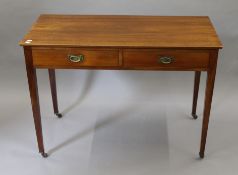 A Victorian mahogany two drawer side table. 106.5 cm wide x 50.5 cm deep.