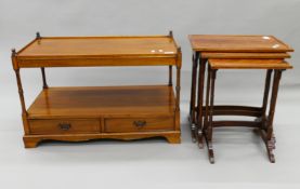 A 20th century mahogany nest of three tables and a side cabinet. The latter 88 cm wide.