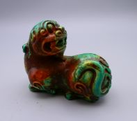 A turquoise dog-of-fo scroll weight. 8 cm long.