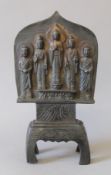 An Eastern bronze five deity shrine group. 23 cm high.