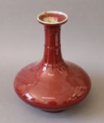 A Chinese pottery sang de boeuf vase. 38 cm high.