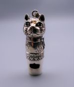 A silver cat whistle. 4 cm high.