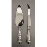 A silver handled King's pattern cake knife and cake server, hallmarked Sheffield 1966 and 1970.