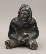 A carved model of an Inuit. 15 cm high.