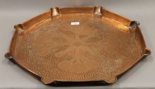 A large Arts and Crafts copper charger. 61 cm diameter.