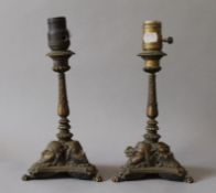 A pair of 19th century bronze candlesticks, with lamp conversions. 27.5 cm high.