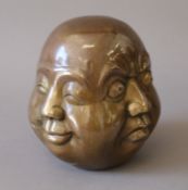 A bronze four faced Buddha. 13 cm high.