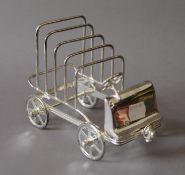 A silver plated car formed toastrack. 16 cm long.