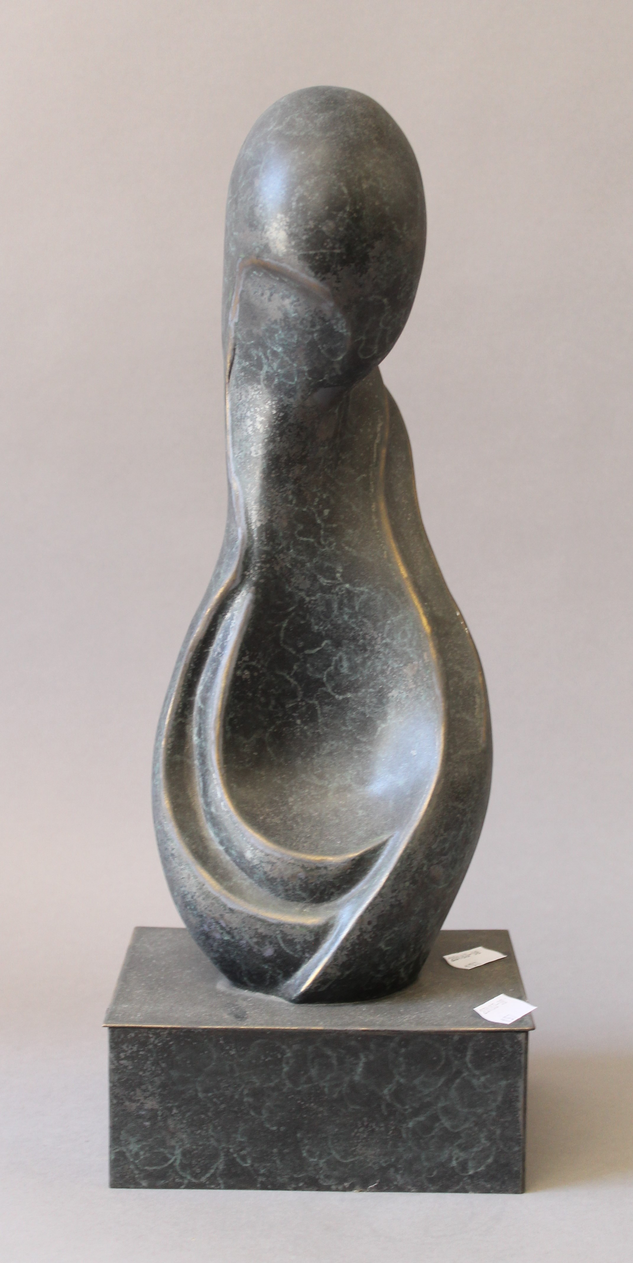 A patinated bronze abstract sculpture. 42 cm high.