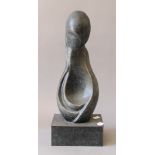 A patinated bronze abstract sculpture. 42 cm high.