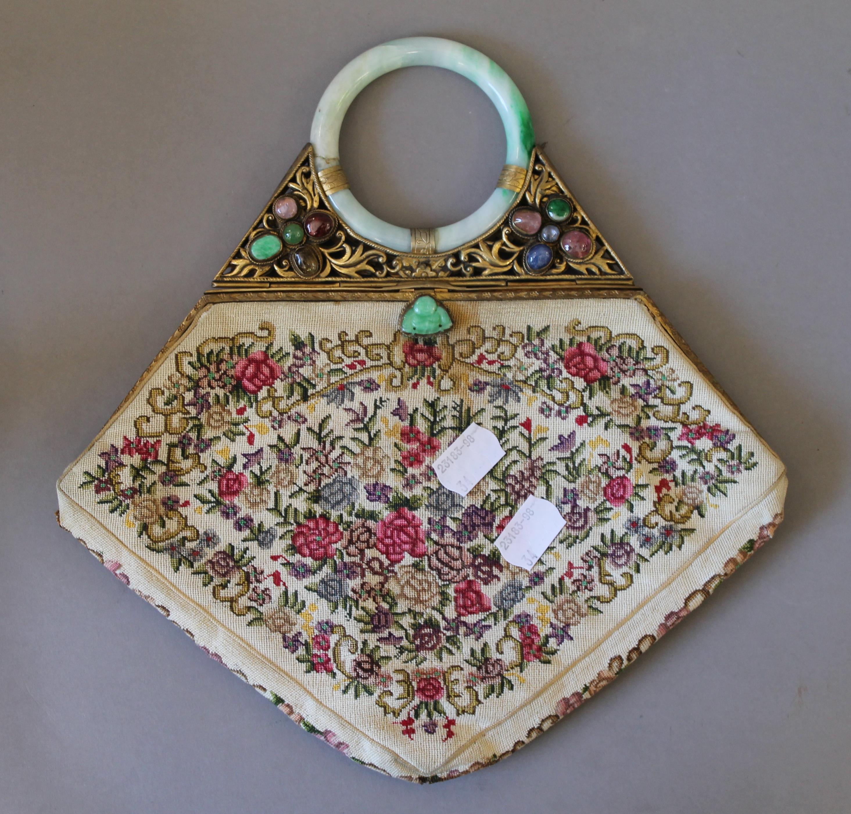 A jade handled evening bag. 25 cm wide.