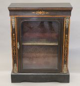 A Victorian inlaid and gilt metal mounted ebonised pier cabinet. 81 cm wide.