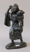 A Japanese Meiji period patinated bronze model of a woman and child. 27 cm high.