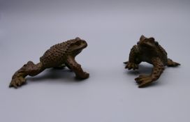 A pair of bronze frogs. Each approximately 5 cm long.