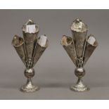 Two silver triple bud vases. 16 cm high.
