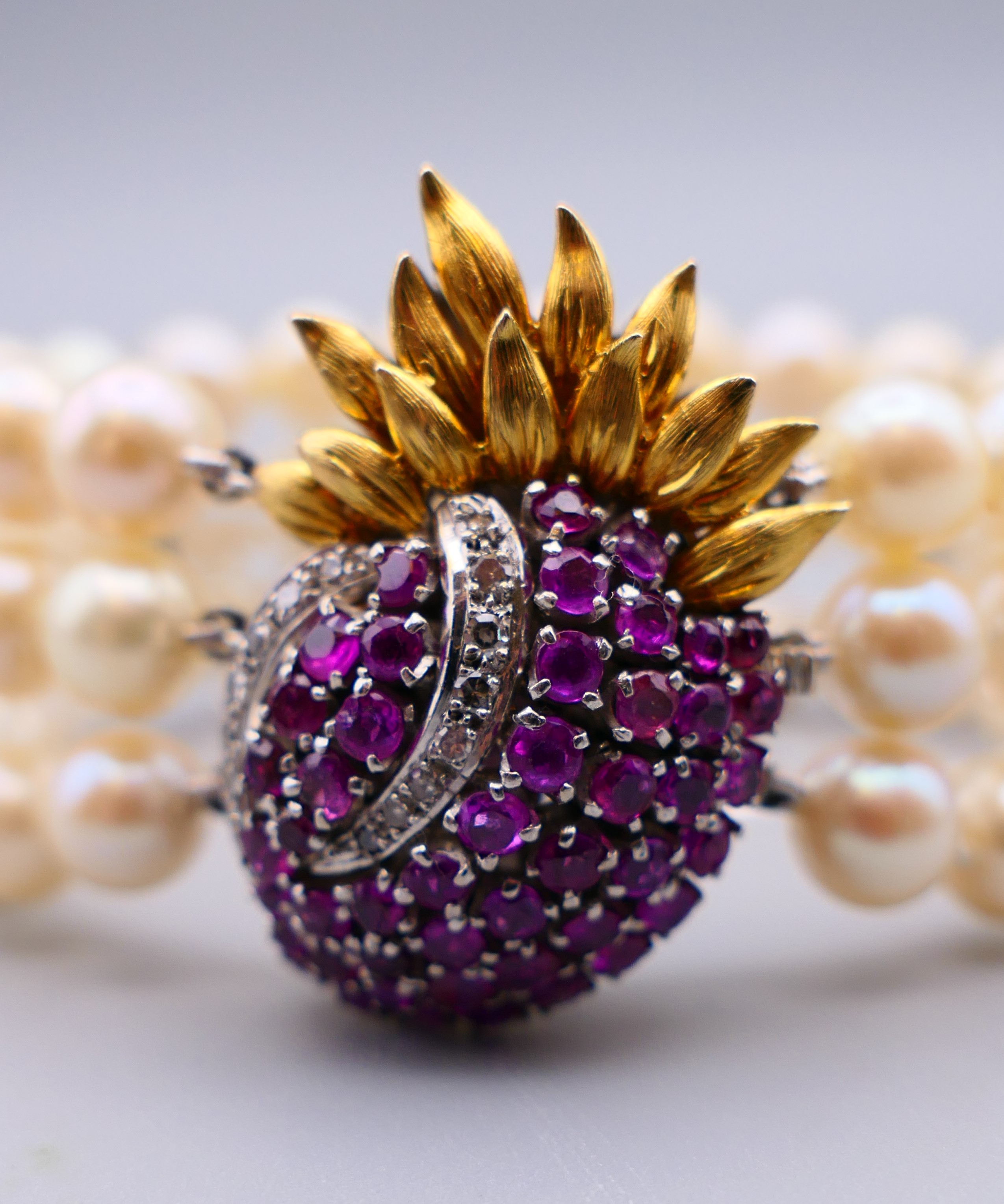A three strand pearl bracelet, with ruby and diamond set 14 K gold clasp. 18 cm long. - Image 3 of 12